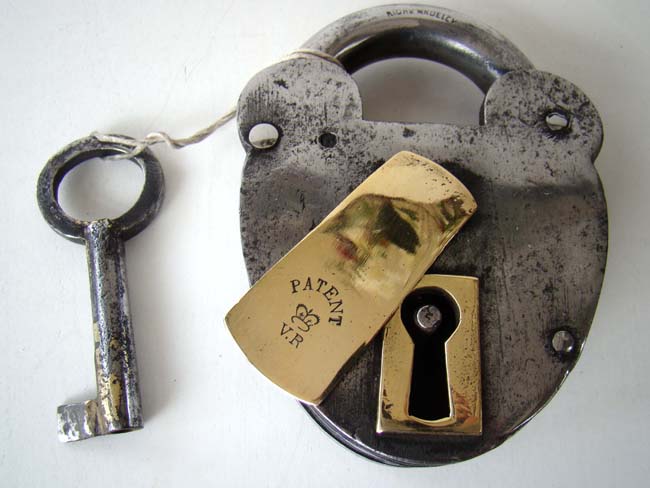 A large early Victorian Brass and Steel Padlock by Richard Madeley circa 1840